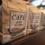 three bags of coffee sitting on top of a counter