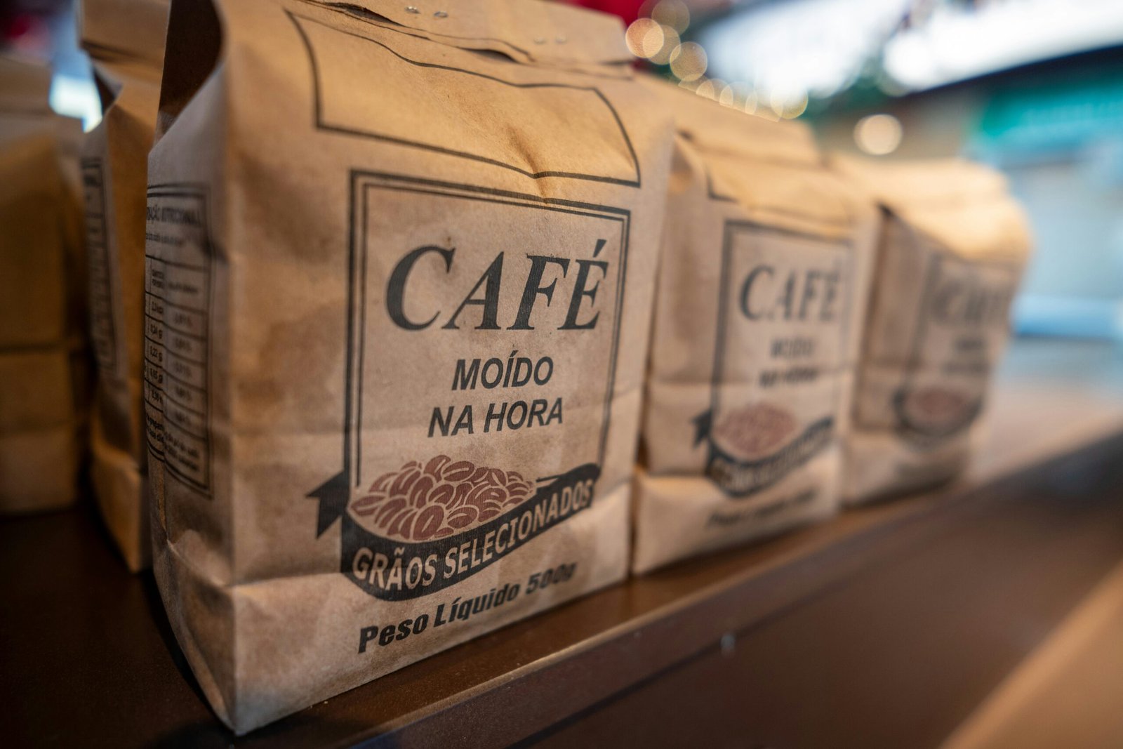 three bags of coffee sitting on top of a counter